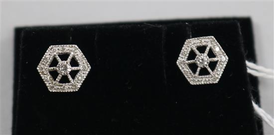 A pair of pierced 18ct white gold and diamond set hexagonal ear studs.